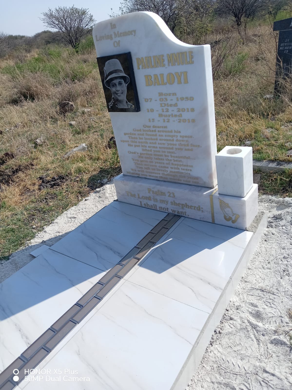 Book-style open granite tombstone