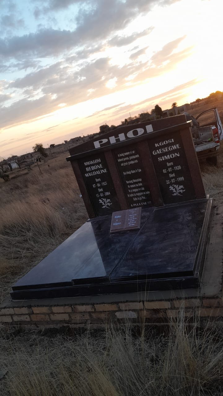 Phoi double memorial with maroon accents at sunset