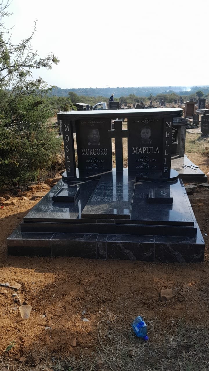 Double memorial with photo portraits and oval canopy design