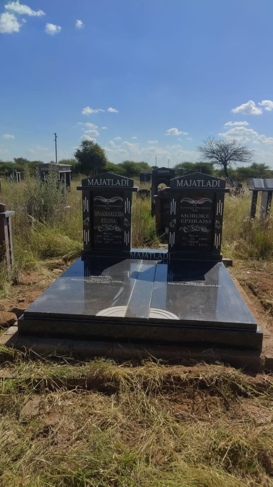 Majatladi double memorial with arch design in black granite