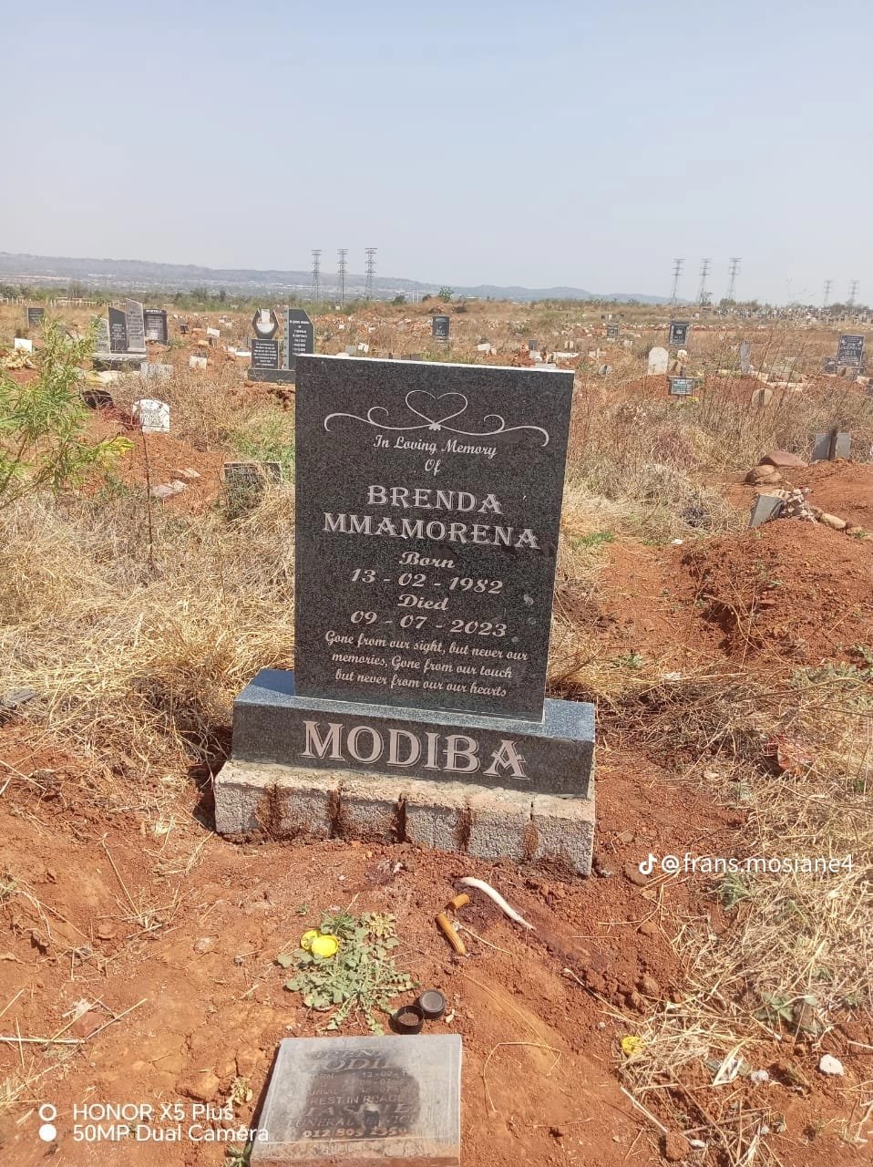 Simple elegant single tombstone with heart scroll design