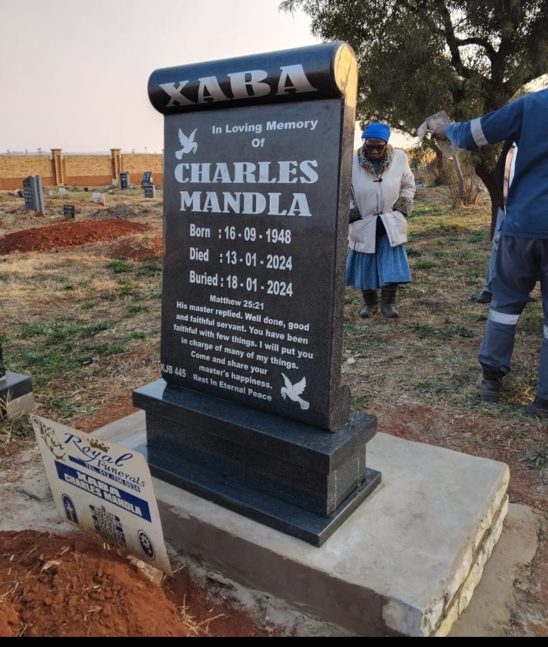 Single scroll-top tombstone with scripture engraving